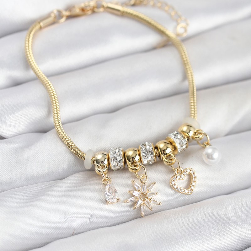 Pirinç Gold Renk Kutup Yıldızı ve Kalp Charmlı Kadın Bileklik