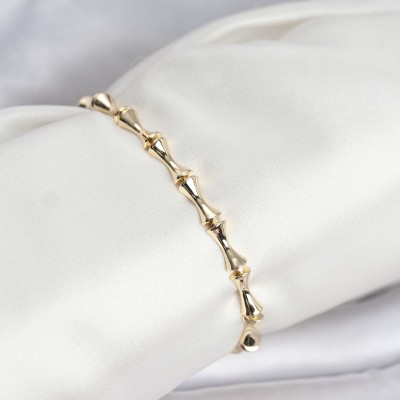 Pirinç Gold Renk VIP Seri Kemik Model Zirkon Taşlı Kadın Bileklik